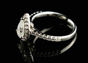 1.0Ct Pear Cut Moissanite Engagement Ring Set In Sterling Silver