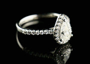 1.0Ct Pear Cut Moissanite Engagement Ring Set In Sterling Silver