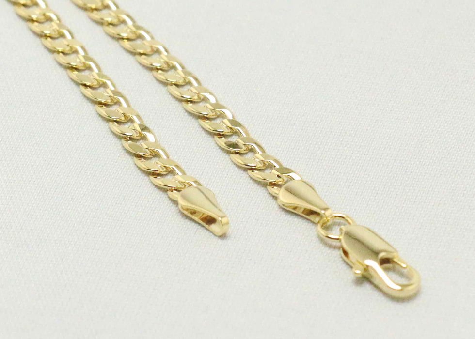 Cuban chain with indented cross charm