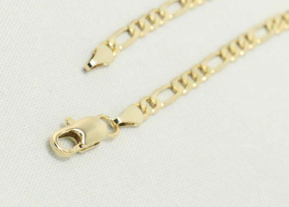 Figaro chain with gold nugget cross charm
